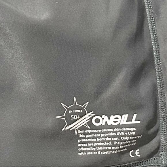 O'Neill Women's Basic Skins UPF 50+ Short Sleeve Rashguard Graphite Medium - Picture 2 of 8